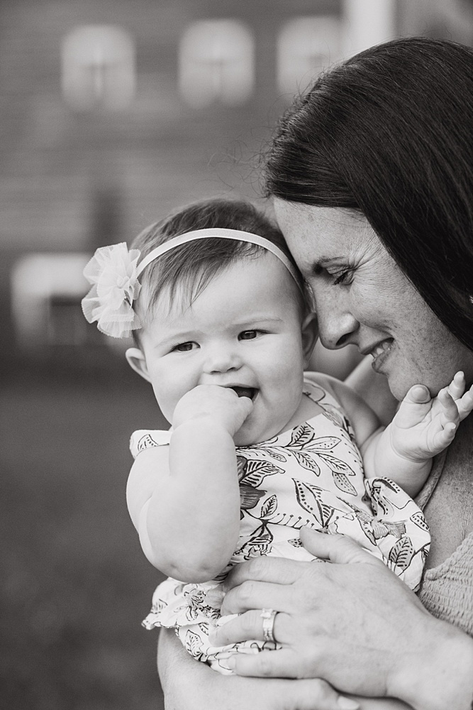 mom smiling at baby girl by Vermont family photographer