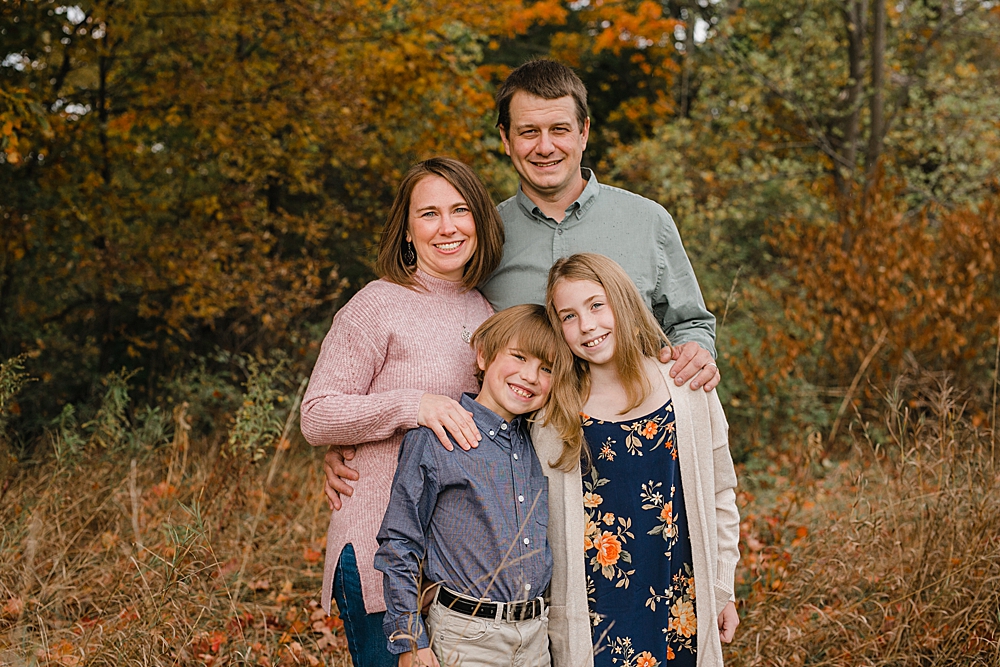 family among fall foliage by Vermont family photographer