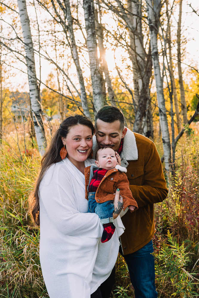 Vermont Family with setting sun behind them in foliage season